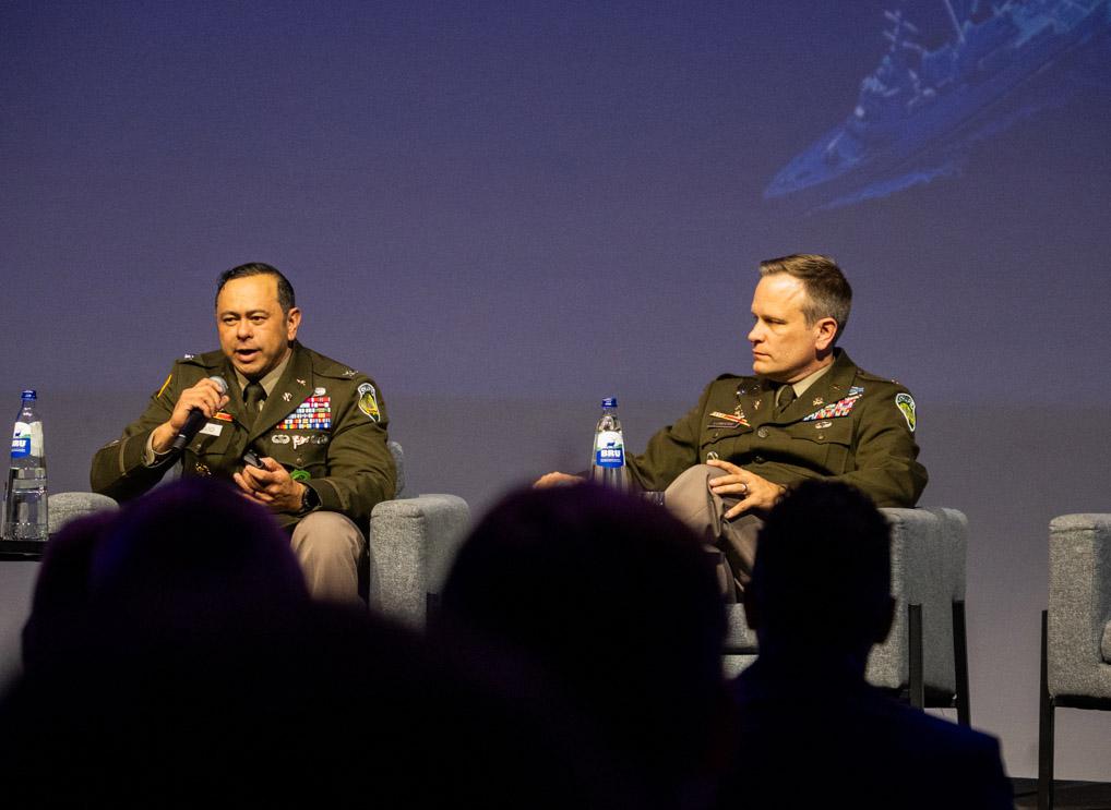 Col. Arnel David (l) and Lt. Col. Ash Lubecke discuss NATO’s Maven Smart System in Brussels. Photo: Infodos