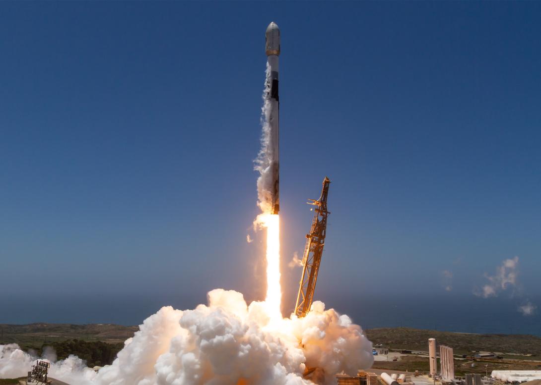 A SpaceX Falcon 9 rocket lifts off in support of a National Security Space Launch (NSSL) mission to deliver 21 Space Development Agency data transport Trance 1 space vehicles to orbit from Space Launch Complex 4 East, Vandenberg Space Force Base, California, on July 16, 2026. SpaceX's newest task order award includes 18 Falcon 9 launches. Credit: Courtesy photo by SpaceX