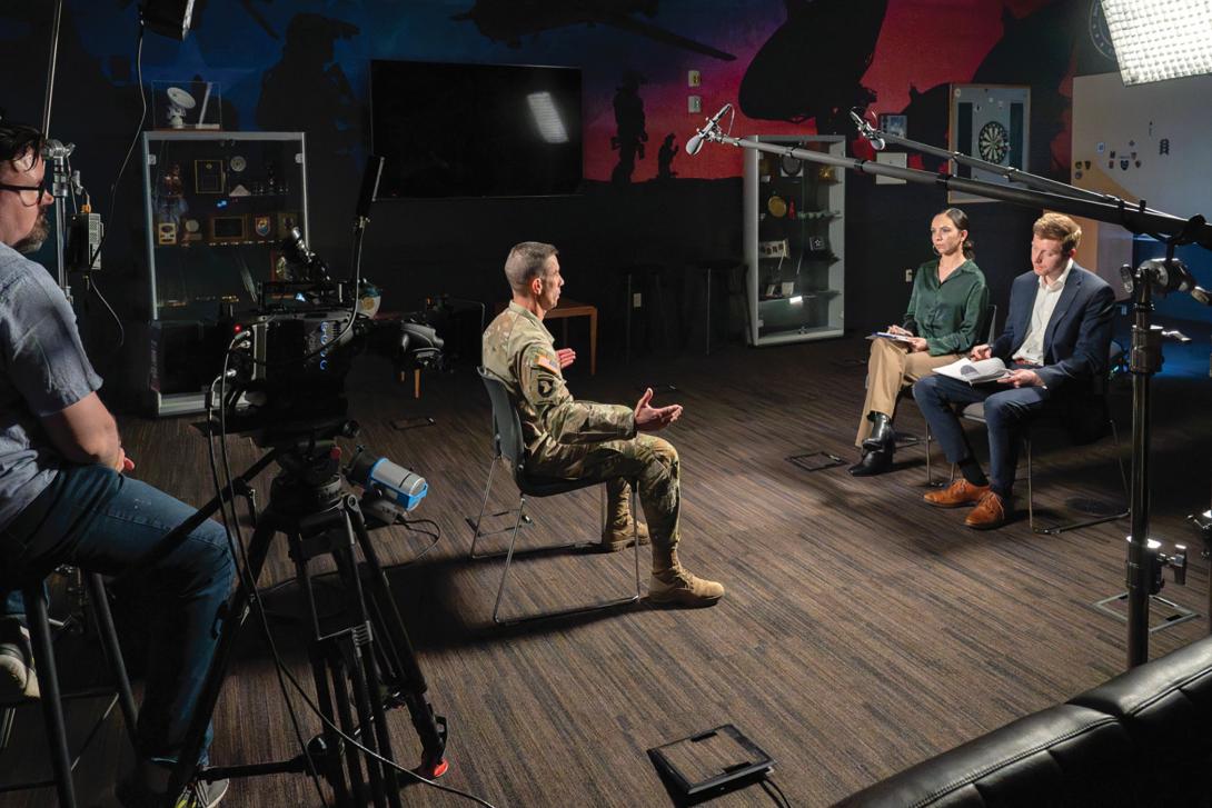 SIGNAL Media reporters Nuray Taylor and Evan Lynch interview Lt. Gen. Paul Stanton, USA, director of the Defense Information Systems Agency and commander of the Department of War Cyber Defense Command, in April. Credit: Edward Cannon, DISA Photographer