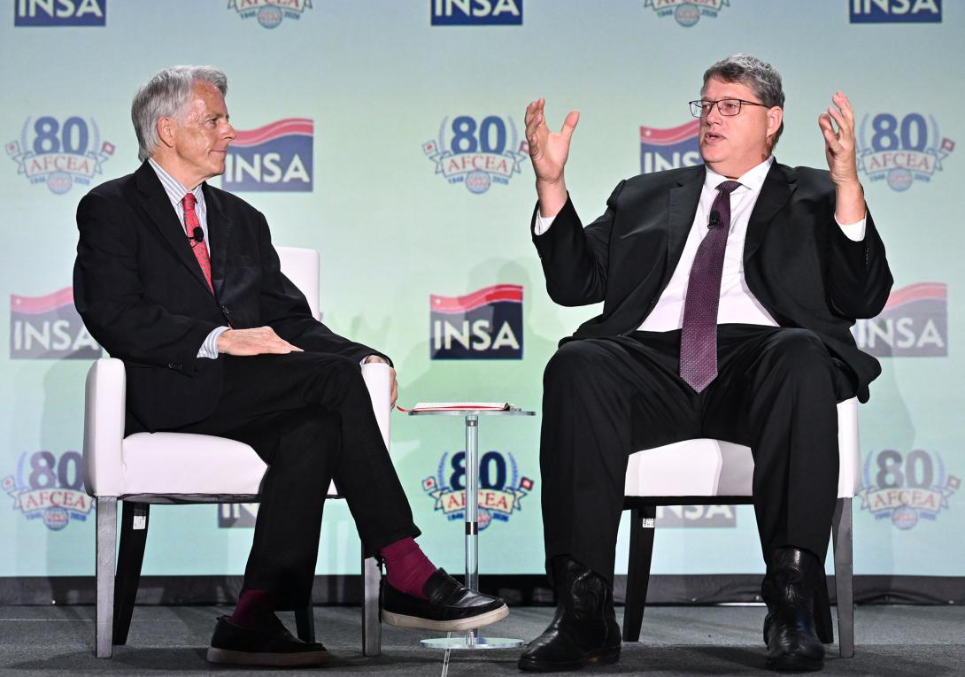 Lewis Shepherd (l), chief technology officer, Broadcom, Federal, and chair, AFCEA International's Intelligence Committee, listens to Greg Ryckman, special advisor to the director, Defense Intelligence Agency at the 2026 Intelligence Summit on August 26. Credit: Herman Farrar Photography