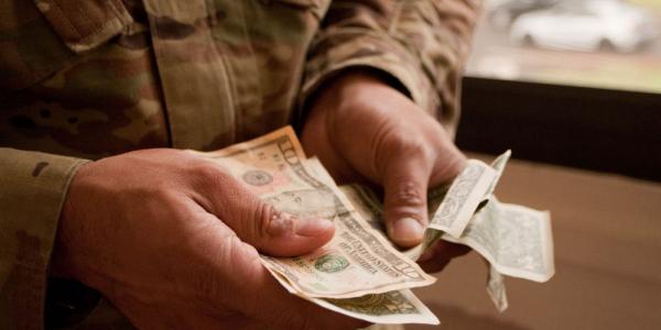 Money comes in many forms. Are paper bills or checks the safest way to pay? (U.S. Army photo by Kristen Wong)