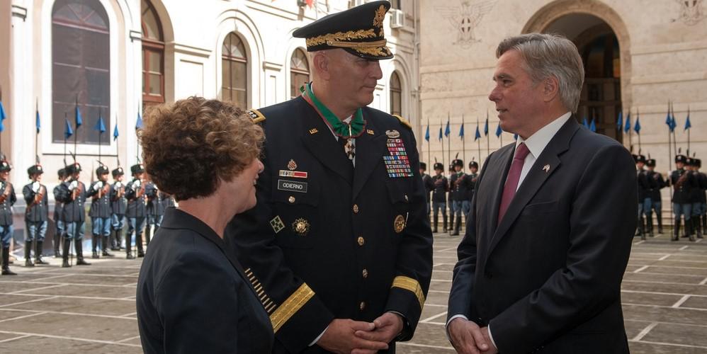Gen. Raymond T. Odierno, USA (Ret.) (c) , and his wife, Linda (l), speak in 2013 with David Thorne, former U.S. ambassador to Italy, during a ceremony at the Italian army headquarters in Rome, when Gen. Odierno received the Order of Merit of the Italian Republic. The general passed away last weekend at age 67. Credit: U.S. Army photo by Staff Sgt. Teddy Wade
