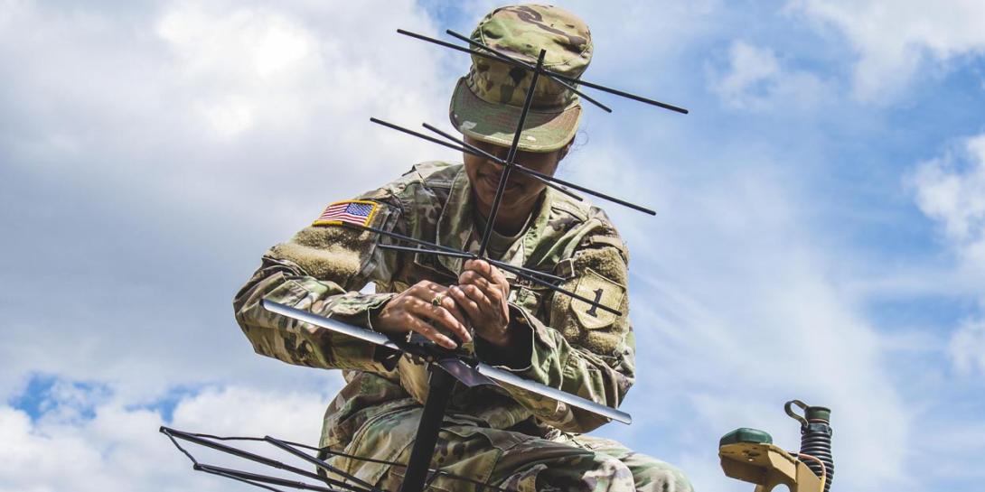 A soldier helps set up a tactical command post to test communications in Germany, July 8, 2019.  Photo by Army Sgt. Patrick Jubrey