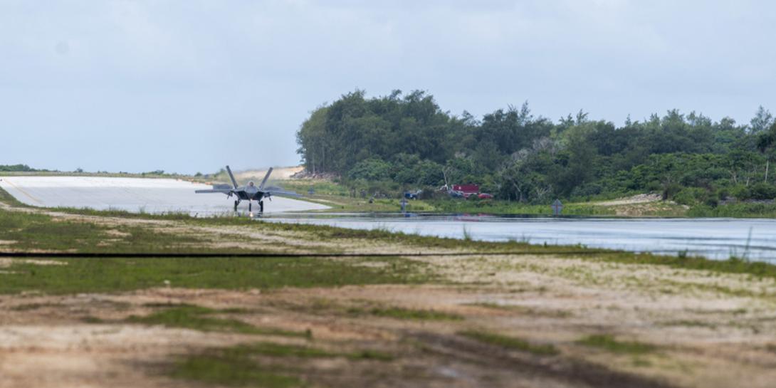 A U.S. Air Force F-22 Raptor assigned to the 525th Fighter Squadron completes agile combat employment (ACE) maneuvers during Operation Pacific Iron 2021 at Northwest Field, Guam, in July. The austere conditions of the former World War II airfield offered ideal conditions for airmen to train in ACE. Credit: Air Force photo by Senior Airman Alexandra Minor.