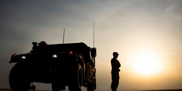 A U.S. Army soldier stands outside a Humvee before the start of the Dasman Shield live fire exercise in Kuwait in February. During the exercise, the military looked at the beginnings of all domain operations, including air-to-ground command control, as well as partner interoperability with Kuwaiti forces.  U.S. Air Force photo by Senior Airman Kevin Tanenbaum