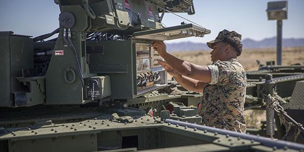 U.S. Marines conduct a routine check up on an AN/TPS-59 radar. New agile spectrum efforts by the Defense Information Systems Agency (DISA) aim to allow more efficient spectrum use on the battlefield while sharing spectrum with civilian bandwidth users. Credit: U.S. Marine Corps photo by Lance Cpl. John Hall, USMC