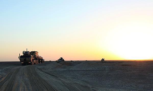 A 60-vehicle convoy of Marines with the 8th Engineer Support Battalion, 1st Marine Expeditionary Force, and MARSOC Marines moves into Shurakay village, Helmand province, at dusk.