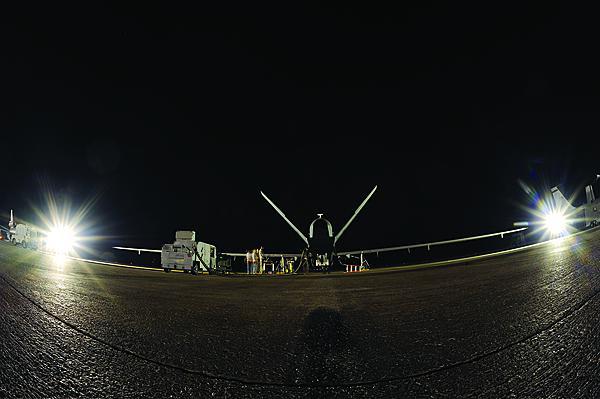 An Air Force EQ-4 Global Hawk carrying the Battlefield Airborne Communications Node, or BACN, awaits takeoff in Southwest Asia. Unmanned aerial vehicles will be relied on to an increasing degree for providing vital network links among a broad range of theater forces.