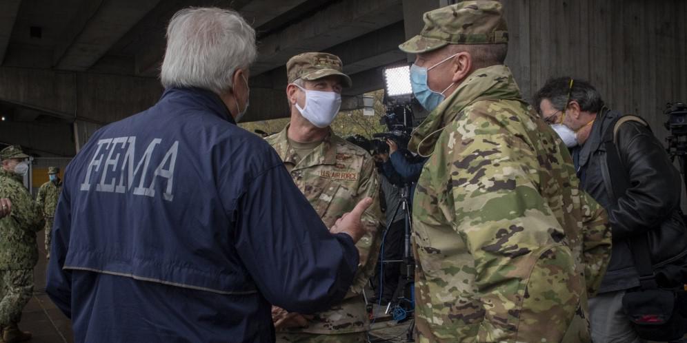 FEMA Regional Administrator Thomas Von Essen and Maj. Gen. Bill Hall, USA, former commander, Joint Task Force Civil Support, during a visit to New York City and USNS Comfort in April 2020. The U.S. Northern Command, which responds to domestic humanitarian crises, and the other combatant commands could expand the use of artificial intelligence through specialized teams at each command. Credit: U.S. Navy photo by Specialist 1st Class Kleynia McKnight