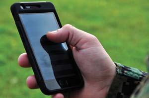 A U.S. Marine experiments with Lighthouse software on a mobile device.