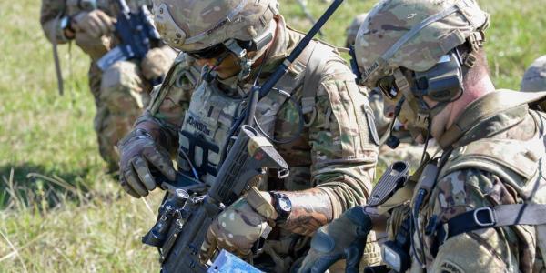 1st Lt. Zachary Johnson, USA (l), uses a Nett Warrior end-user device during air assault training as part of Exercise Saber Junction 2018 at the Grafenwoehr Training Area, Germany. 1st Lt. Johnson is assigned to the 1st Battalion, 503rd Infantry Regiment, 173rd Airborne Brigade, one of several units evaluating the Integrated Tactical Network (ITN) during operational exercises to help inform design decisions for future Infantry, Stryker and Armor formations.  U.S. Army photo/Spc. Rolyn Kropf, USA