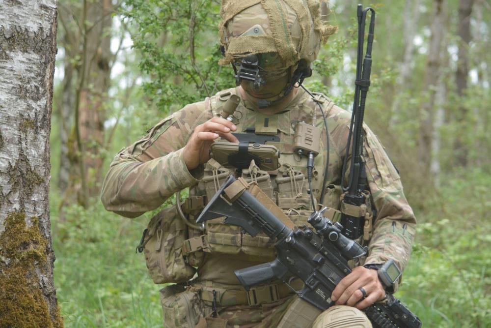 1st Lt. Michael Austin, USA, platoon leader for Attack Company, 1-503rd Infantry Regiment, 173rd Airborne Brigade, uses the Nett Warrior end-user device to report information to his company commander through the ITN during a live-fire exercise in Grafenwoehr, Germany.  U.S. Army photo/Spc. Joshua Cofield, USA