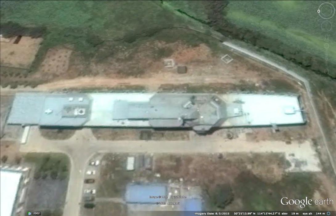 Satellite imagery of a land-based mock-up of China’s new 055 warship shows advanced radar on a bridge structure positioned for electromagnetic interference testing. The 055 is being designed to serve as a key escort for a People’s Liberation Army Navy aircraft carrier task force.