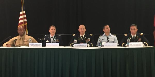 Cyber operators (l-r) Lt. Col. Barian Woodward, USMC; Lt. Col. Angela Waters, USAF; Lt. Col. Benjamin A. Ring, Ph.D., USA; Lt. Jr. Clovis Guevara, USCG; and Col. Paul T. Stanton, USA, panel moderator, address attendees at AFCEA's first Cyber Education, Research and Training Symposium.