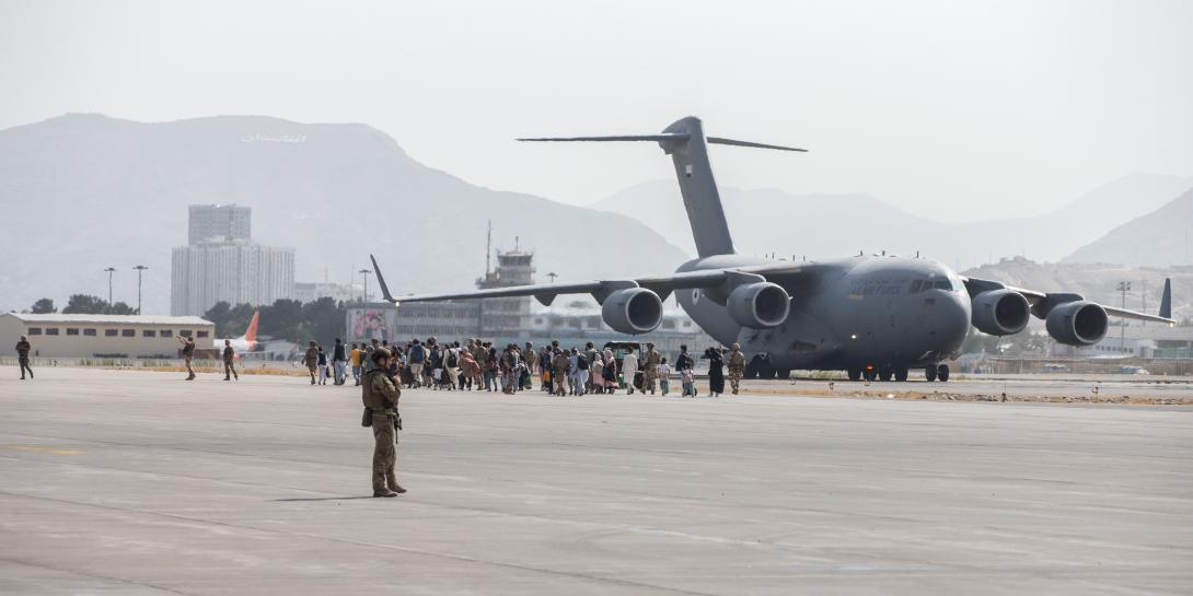 Evacuees load on to a United Arab Emirates (UAE) Boeing C-17 Globemaster III during the evacuation at Hamid Karzai International Airport, Kabul, Afghanistan, August 2021. The office of the Joint Staff J-6 initiated Project Orsus to overcome data challenges associated with the evacuation and say that project will likely impact the future of joint all-domain command and control.  U.S. Marine Corps photo by Sgt. Samuel Ruiz