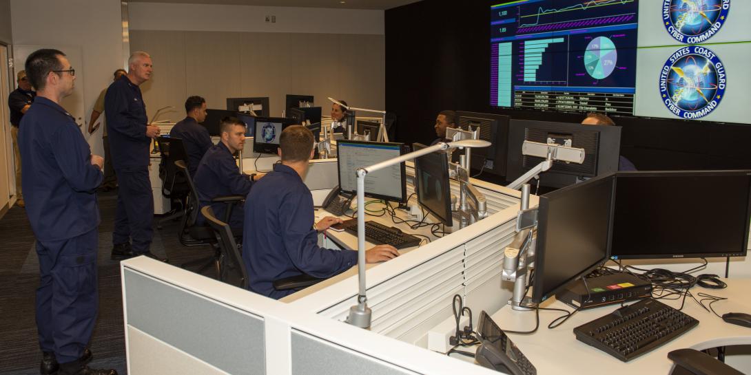 The addition of cyber offense capabilities by the U.S. Coast Guard Cyber Command marks another step in the service’s growing cyber versatility, says the leader of the command, Rear Adm. Michael Ryan, USCG (l), speaking to Coast Guardsmen in the command’s Cyber Operations Center in Washington, D.C. Credit: USCG Cyber Command