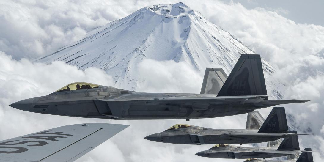 U.S. Air Force F-22 Raptors fly alongside an Air Force KC-135 Stratotanker during training near Mount Fuji, Japan, earlier this year. U.S. Indo-Pacific Command is building a mission partner environment that will allow greater interoperability between U.S. forces and international partners and allies in the region. Credit: Air Force Senior Airman Rebeckah Medeiros