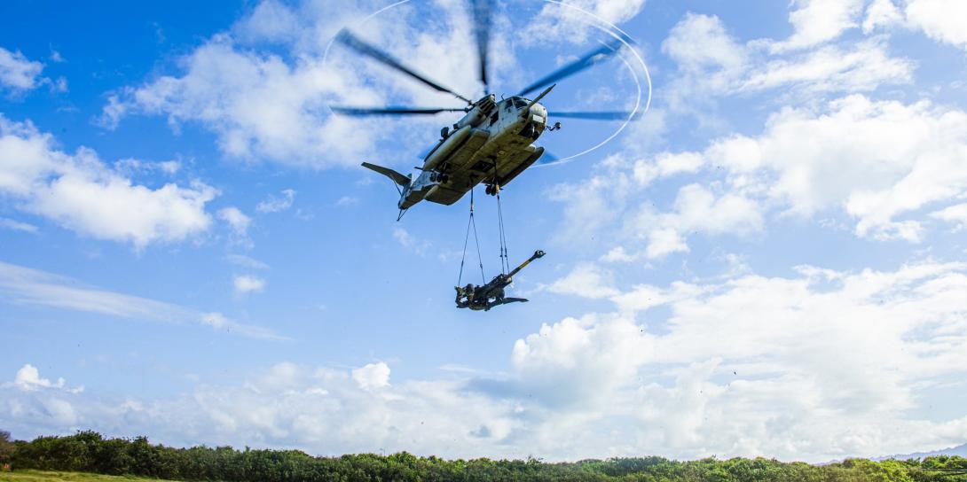 U.S. Marines with the 1st Battalion, 12th Marine Regiment and Marine Heavy Helicopter Squadron 463 use a CH-53-E to lift an M777 Howitzer in Hawaii in January. The Marine Corps is developing a different kind of regiment, called the Marine Littoral Regiment, to perform expeditionary, advanced base operations. Credit:  USMC, 1st Battalion