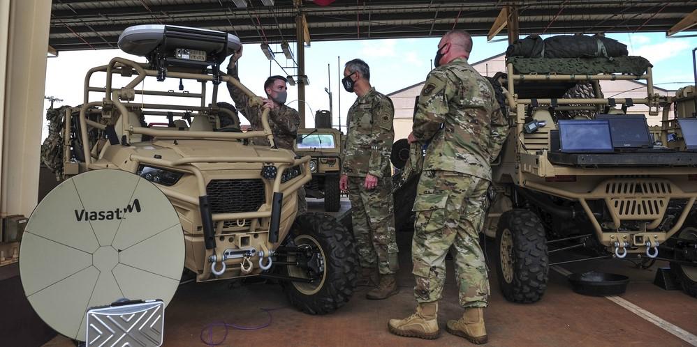 In April 2021 at Wheeler Army Airfield, Hawaii, Staff Sgt. Christopher Watson, USAF, 25th ASOS Radio Frequency Transmissions craftsman (l), speaks with Gen. Ken Wilsbach, USAF, Pacific Air Forces (PACAF) commander (c) and Chief Master Sgt. David Wolfe, USAF, PACAF command chief, about the 25th ASOS’ joint all-domain command and control (JADC2) capabilities. Authors of a new study are warning about the growing risks of JADC2 on space-based solutions. Credit: U.S. Air Force photo by Tech. Sgt. Nick Wilson