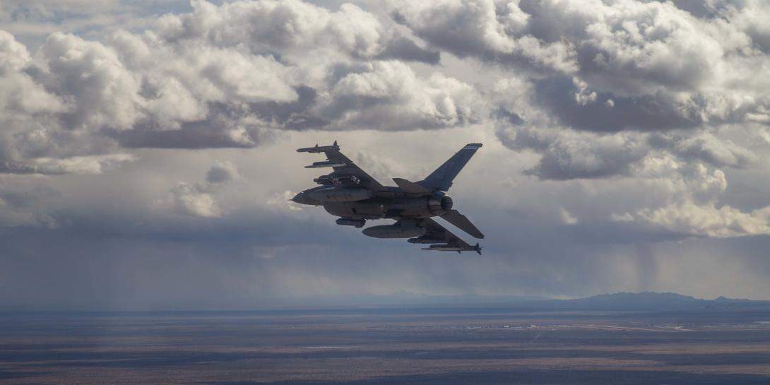 A 40th Flight Test Squadron F-16D Fighting Falcon prepares to drop four bombs for the second Golden Horde test mission designed to provide proof of concept for collaborative autonomous weapons.  U.S. Air Force photo by Tech. Sgt. John Raven, USAF