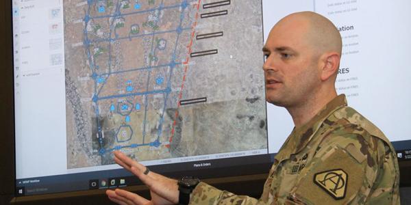 U.S. Army Project Manager Mission Command's (PM MC’s) Maj. Tim Forry explains new software features of the Command Post Computing Environment recently at Aberdeen Proving Ground.