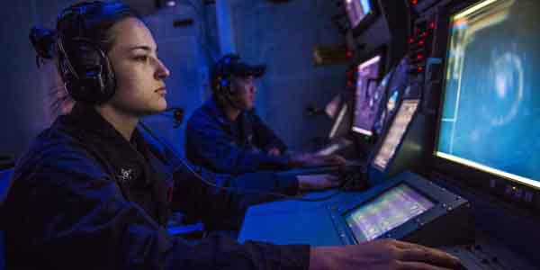 A sonar technician onboard the guided missile destroyer USS Mustin stands watch in the ship’s sonar center. With cyberspace being a warfighting domain, the U.S. Navy’s information networks are a major target that must be protected and defended proactively.