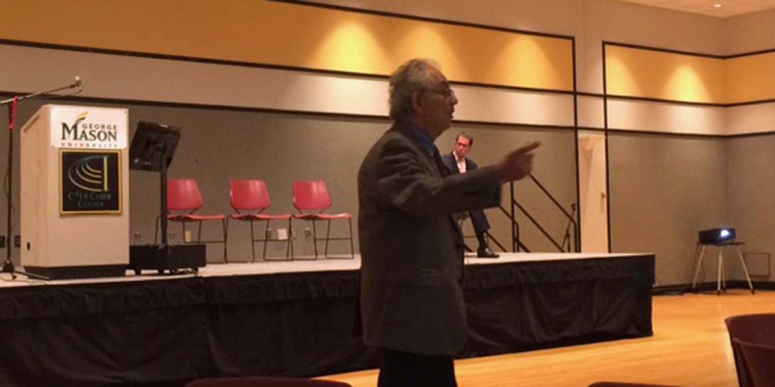 William Halal, chairman of TechCast Global, speaks at the AFCEA International/George Mason University Critical Issues in C4I Symposium.