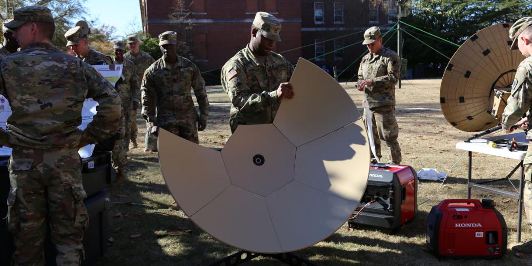 A soldier from Company B, 50th Expeditionary Signal Battalion-Enhanced, tears down a Very Small Aperture Terminal (VSAT) satellite dish during a demonstration on November 29, 2018, at Fort Bragg, North Carolina. Army leaders are working to bring advanced communications technologies into an integrated network. U.S. Army photo by Amy Walker, PM Tactical Network PEO C3T public affairs