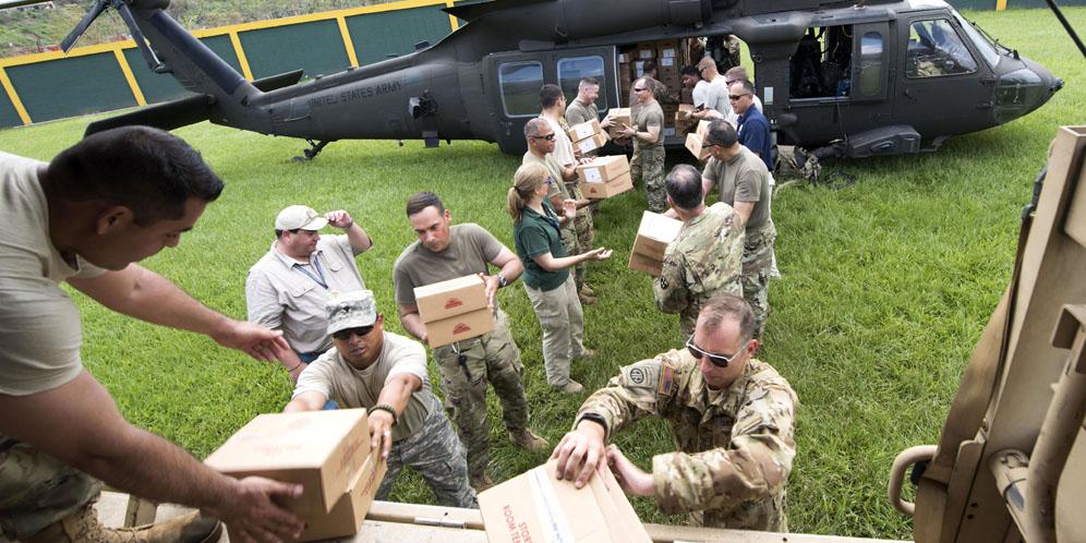 U.S. Army soldiers unload critical supplies in Puerto Rico. The Army also is providing satellite communications in support of hurricane relief efforts in Puerto Rico and the U.S. Virgin Islands.