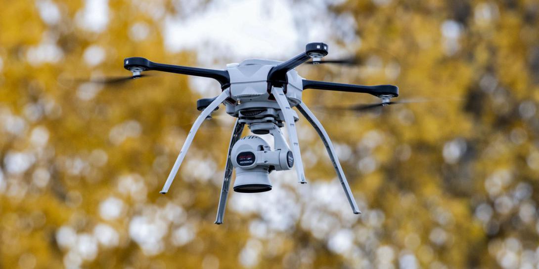 A drone operated by airmen flies over a training area at Joint Base Elmendorf-Richardson, Alaska, in October, while capturing aerial intelligence during a two-week military exercise. Software for unmanned systems goes through extensive and time-consuming testing, but machine learning could change that. Credit: Alejandro Pena, Air Force