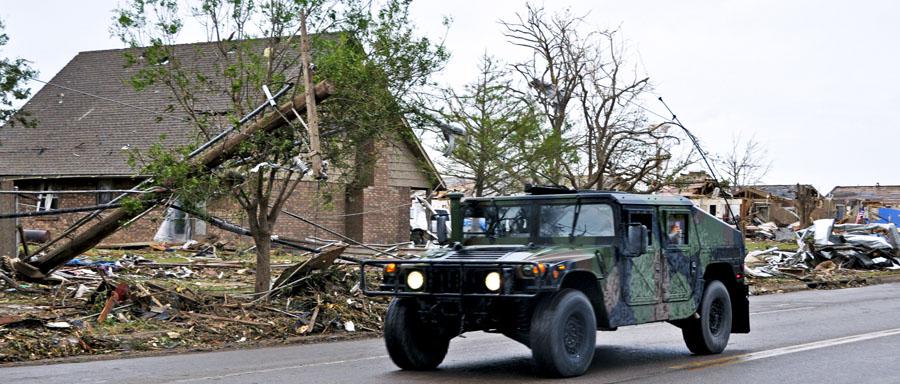 Members of the Oklahoma National Guard drive down Telephone Road in Moore, Oklahoma, May 21, 2013, en route to the neighborhoods devastated by a tornado. Cybersecurity needs to be a priority in the aftermath of major disasters when people and their personal data can be most vulnerable. U.S. Air Force photo by Senior Airman Mark Hyber