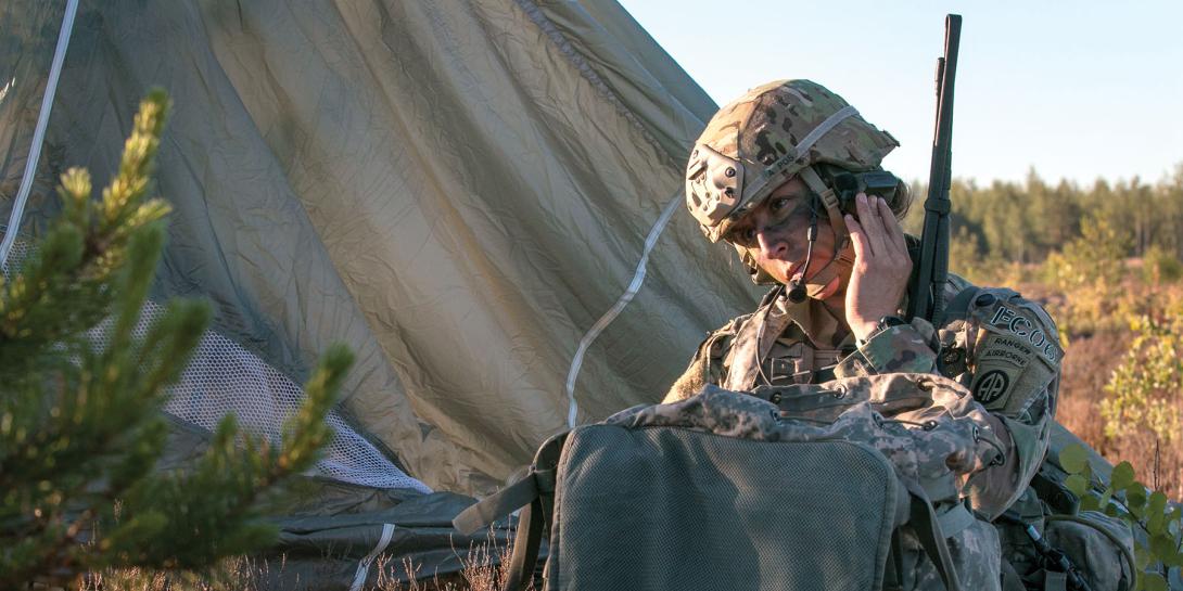 A U.S. Army paratrooper communicates by radio during a drop in Latvia. Traditional radio and network status information will play a key role in cyber situational awareness in the digital battlespace. Credit: Army photography by Spec. Dustin Biven, USA