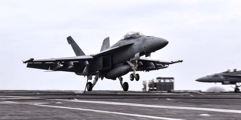 An F/A-18F Super Hornet aircraft lands on the flight deck of the aircraft carrier USS Theodore Roosevelt in the Persian Gulf, December 2, 2017. The Navy just tapped BAE Systems to produce integrated defensive electronic countermeasures for the F/A-18E-F aircraft platform. Navy photo by Petty Officer 3rd Class Rachael Treon.