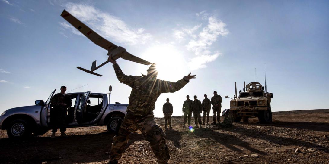 Air Force Tech Sgt. Matthew Coutts launches a Raven B Digital Data Link drone during a demonstration in Southwest Asia in January. The Navy is developing a video game-based tool to evaluate the skills of potential unmanned vehicle operators. Air Force photo by Staff Sgt. Joshua Kleinhol