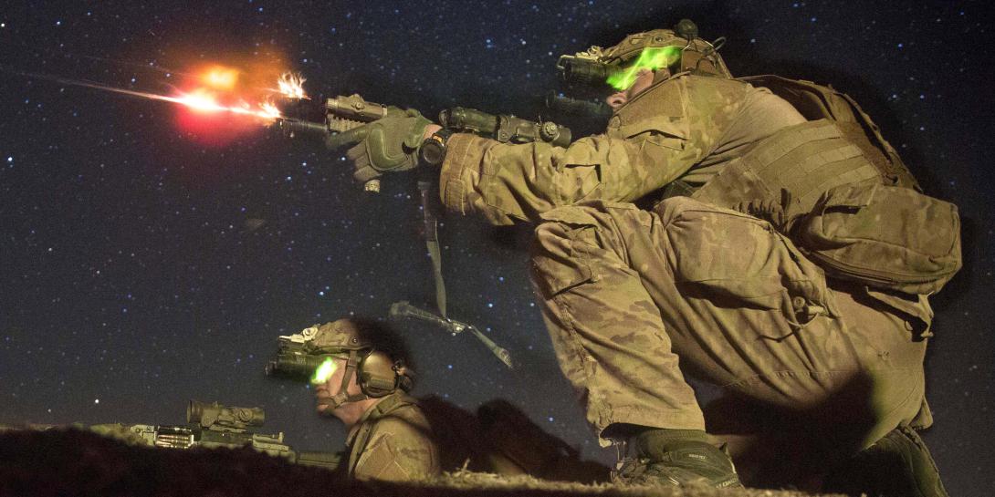 Army Rangers fire at an enemy bunker during a night live-fire training exercise. While live training always will be integral to Army readiness, the service intends to rely more heavily on gaming and simulation.
