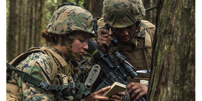A Marine radios in after contact with a simulated enemy during a training exercise in Shizuoka, Japan. The Defense Department has mandated a new software architecture standard for tactical radios. Credit: Marine Corps photo by Lance Cpl. Aaron Henson