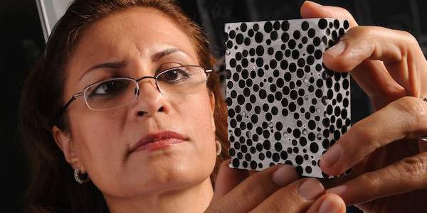 Afsaneh Rabiei examines a sample of composite metal foam. Her pioneering research has led to armor plating that weighs far less than steel and is capable of stopping armor-piercing .50-caliber bullets. Credit: North Carolina State University