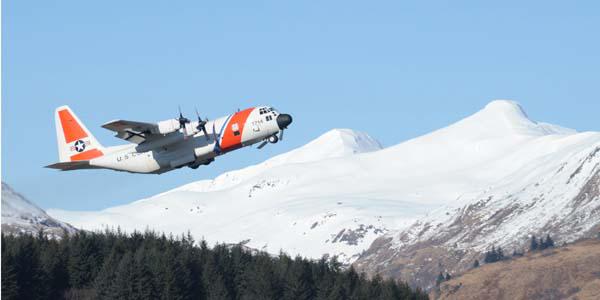 A U.S. Coast Guard HC-130 Hercules aircraft crew takes off from Coast Guard Air Station Kodiak, Kodiak, Alaska, to conduct drop training. Ultimately, Coast Guard officials intend to field a long-range fleet made up entirely of HC-130J Super Hercules aircraft.