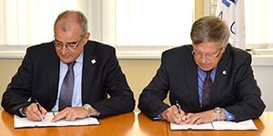 General managers of the NATO Communications and Information (NCI) Agency and AFCEA Europe, Maj. Gen. Koen Gijsbers (Ret.), l, and Maj. Gen. Klaus-Peter Treche, DEUAF (Ret.), sign a renewed Strategic Cooperation Arrangement for another three years.