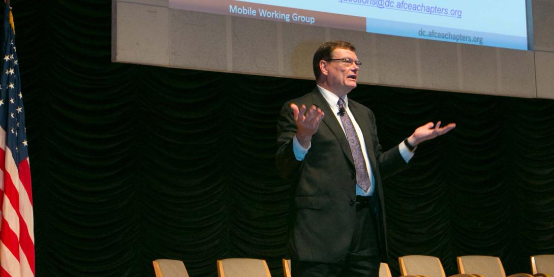 Defense Department CIO Terry Halvorsen says the department needs industry mobility solutions while addressing a sell-out crowd during the AFCEA D.C. Chapter's mobility industry day in Washington, D.C. Photo by Michael Carptenter
