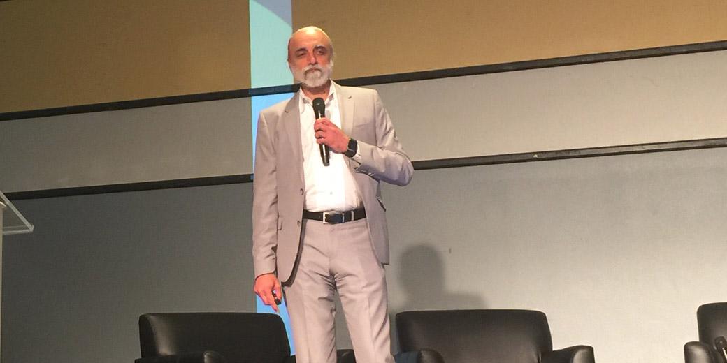 Yuvi Kochar, former chief technology officer for The Washington Post, speaks to attendees at the AFCEA-GMU C4I and Cyber Center Symposium about how CTOs can leverage technology to drive business outcomes.