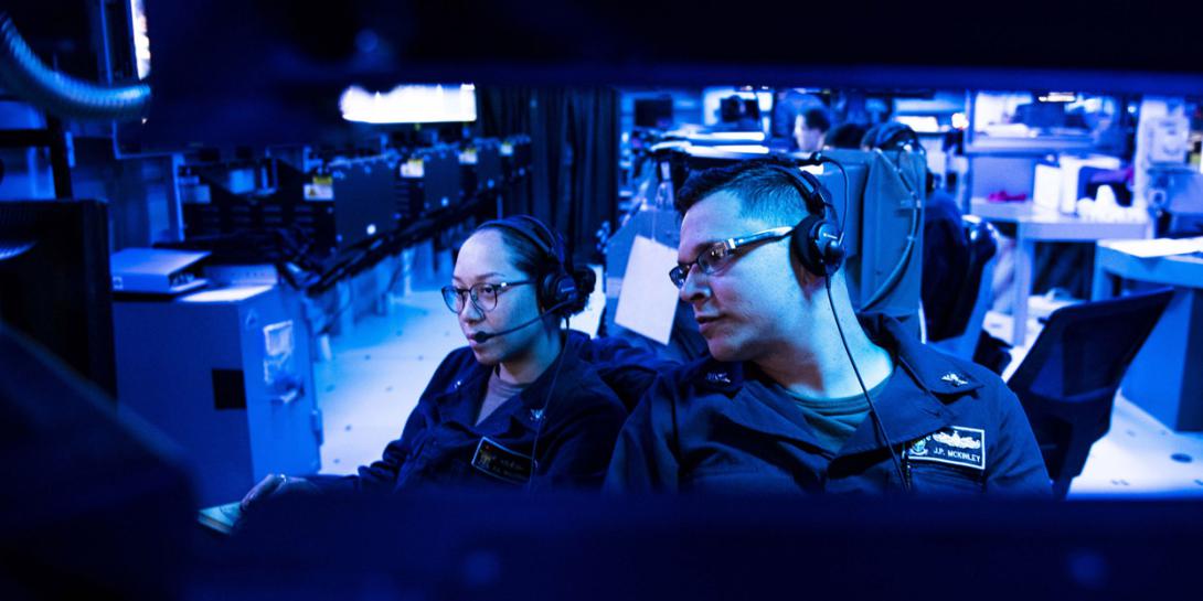 U.S. Navy cryptologic technicians stand watch in the combat information center of the USS Milius in the East China Sea. U.S. Indo-Pacific Command (INDOPACOM) intelligence experts are addressing the long-expected emergence of China as a regional adversary with global intentions. (U.S. Navy photo by MC2 Taylor DiMartino, USN)