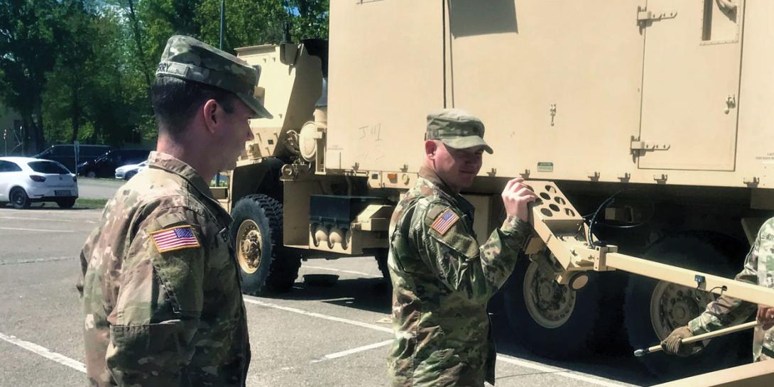 Spc. Dillon Anton, USA, and Spc. Matthew Perry, USA, 601st Aviation Support Battalion, 1st Infantry Division, Combat Aviation Brigade, set up and validate a Combat Service Support Very Small Aperture Terminal (CSS-VSAT) in preparation of Combined Support Exercise at Storck Barracks, Germany.