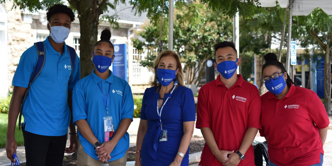 Dr. Irma Becerra, president, Marymount University (c), wears a face mask alongside orientation leaders and community assistants as Marymount students move back to campus for the fall 2020 semester.  Photo by Marymount University