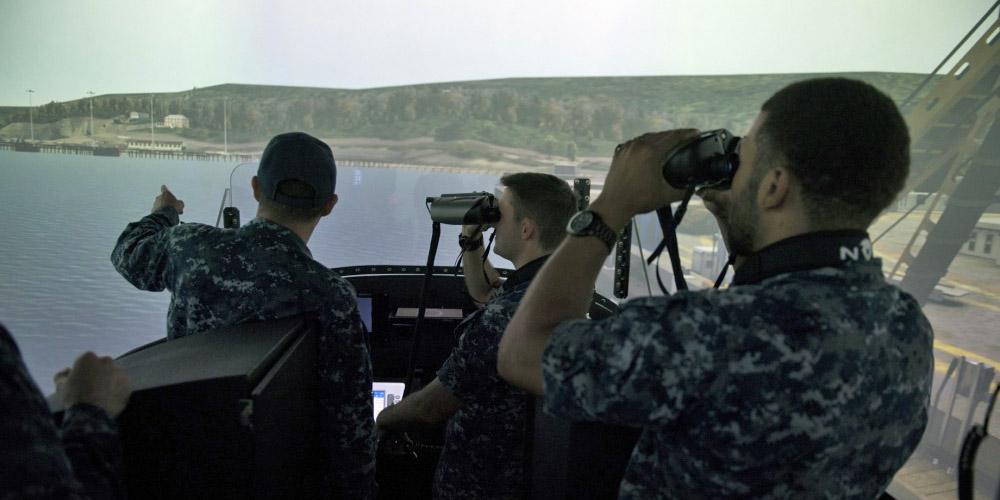 Sailors assigned to the Gold crew of the guided-missile submarine USS Ohio test the new submarine bridge trainer at Trident Training Facility Bangor in Washington.
