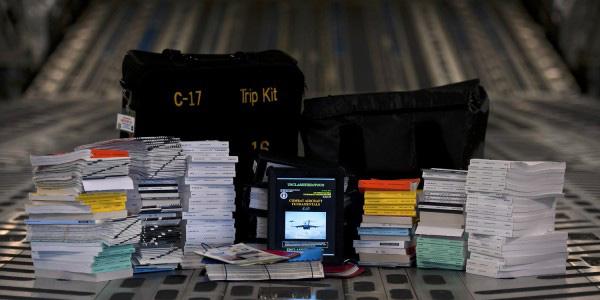 An electronic flight bag (center) replaces the paper flight manuals and products that can weigh nearly 120 pounds.