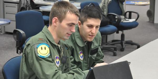 U.S. Air Force students use a tablet for training and education. The Defense Information Systems Agency is supplying tablets to senior leaders under the one-year pilot program.