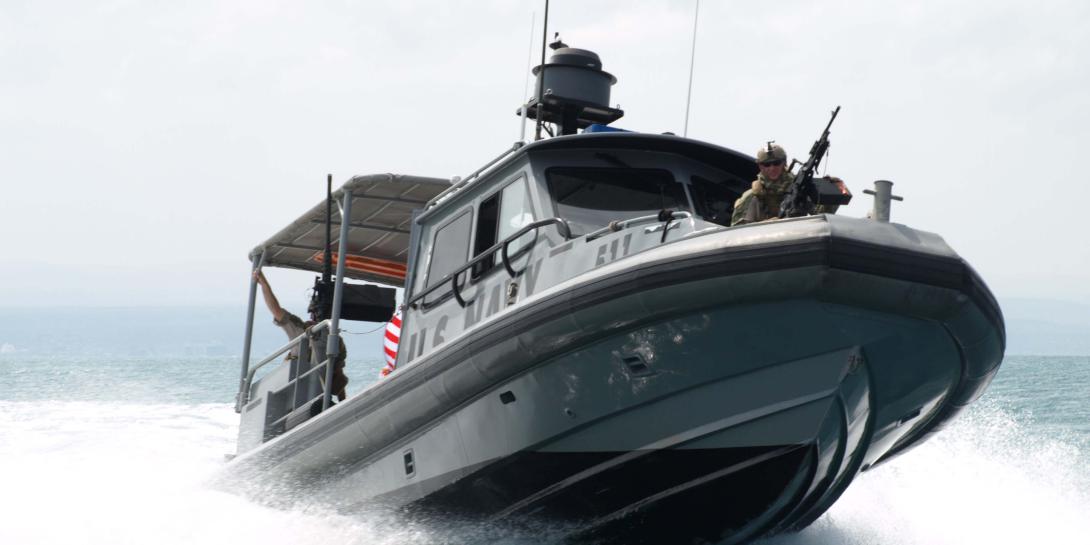 A U.S. sailor of Coastal Riverine Squadron 10 mans a crew-served weapon aboard a patrol boat in the Gulf of Tadjoura, Djibouti. (U.S. Navy photo)