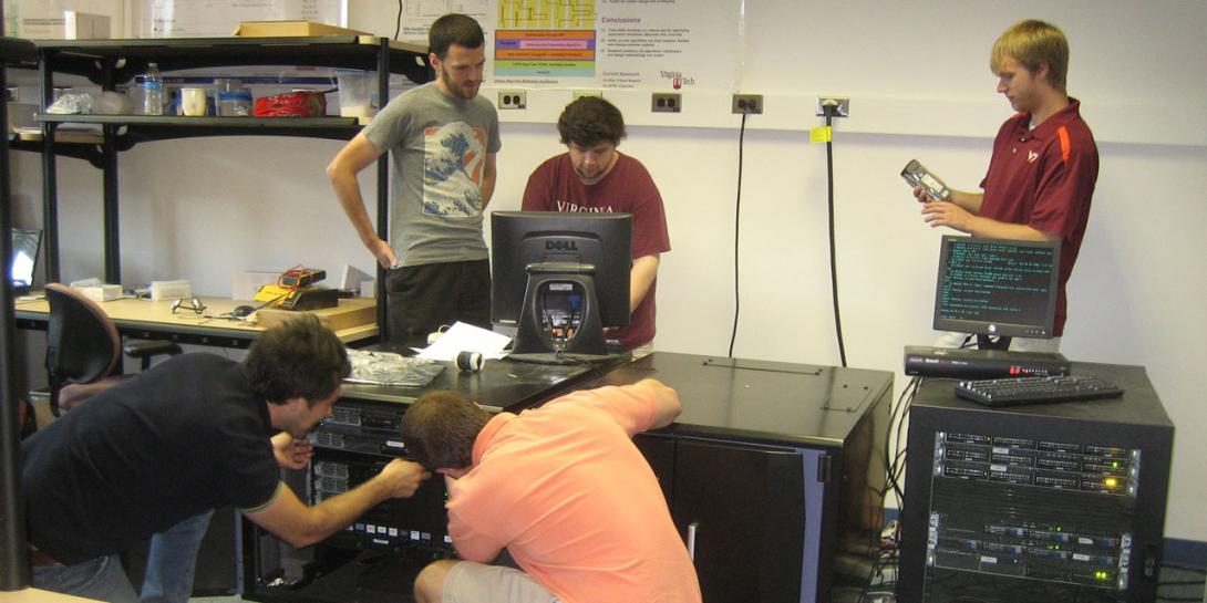 Students in a Virginia Tech laboratory test Popcorn Linux, an operating system that can compile different programming languages into a single cyber tongue. The research is a collaborative effort between the university and the Office of Naval Research. Photo courtesy Binoy Ravindran