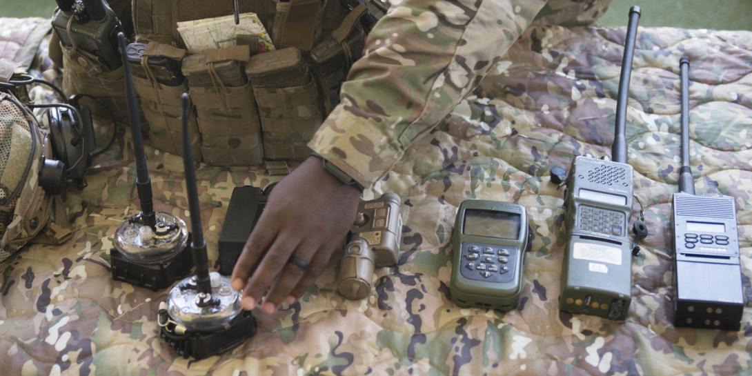 U.S. Special Operations Command (SOCOM) personnel and partner nation representatives examine SOF radio equipment at Air Force Special Operations Command. SOCOM seeks radios that are independent of partners or places so that SOF operators on the move can communicate seamlessly.